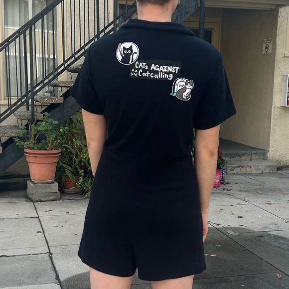 Black short sleeve and pant onesie romper with a button up front. - Picture 4 of 6